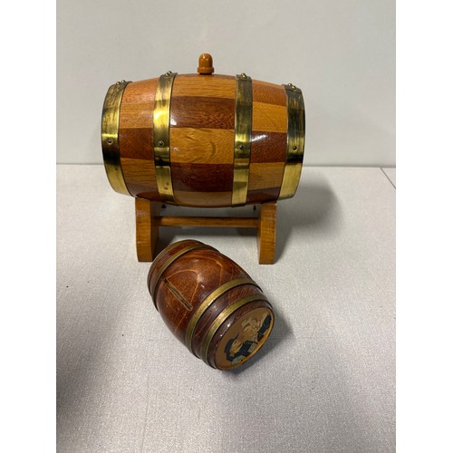 225A - Large oak and brass barrel on stand along with 1 other.