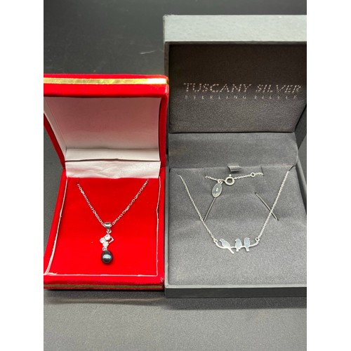 67 - 2 x silver necklaces - black pearl and 3 birds.