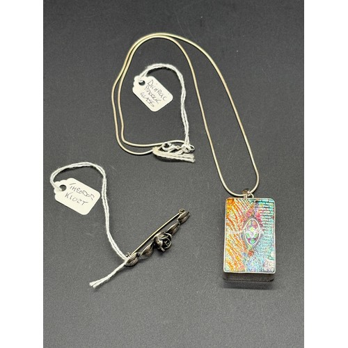 75 - A silver encased rectangular dichroic peacock style heavy glass pendant  with 18ct white g plated  c... 