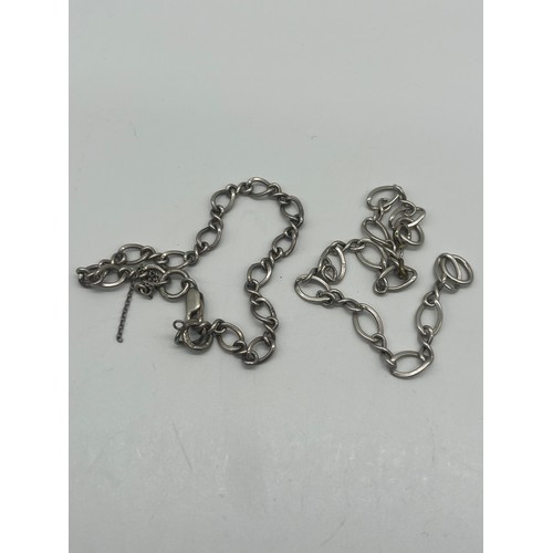 74 - 2 x silver link charm carrier bracelets.
