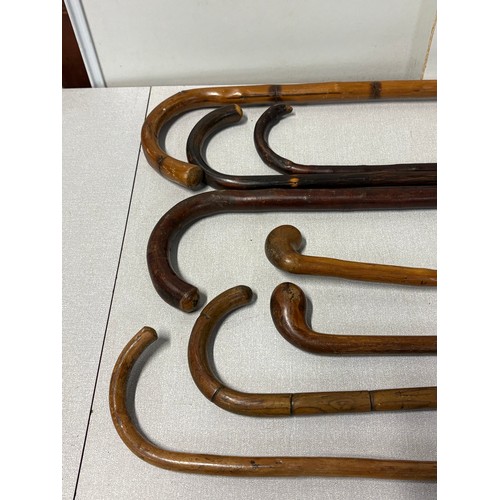 100 - Selection of 8 vintage walking sticks.
