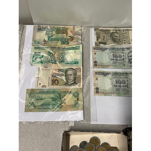 Selection of foreign bank notes & coins.