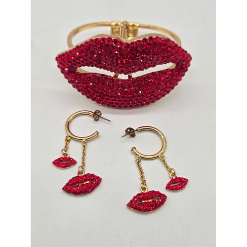 84 - Vintage Butler & Wilson ruby red lip rhinestone bangle & earrings set.