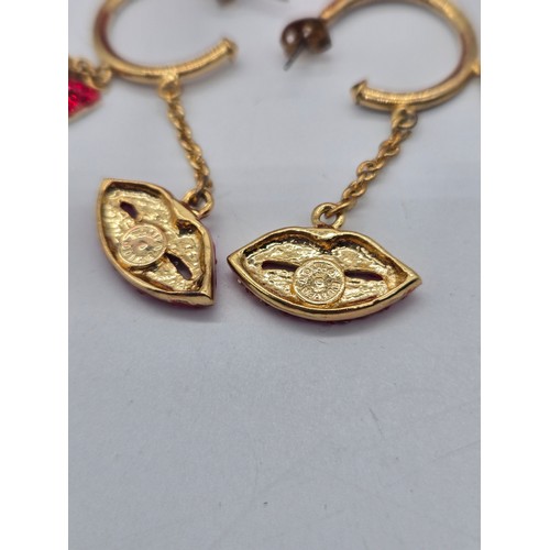 84 - Vintage Butler & Wilson ruby red lip rhinestone bangle & earrings set.