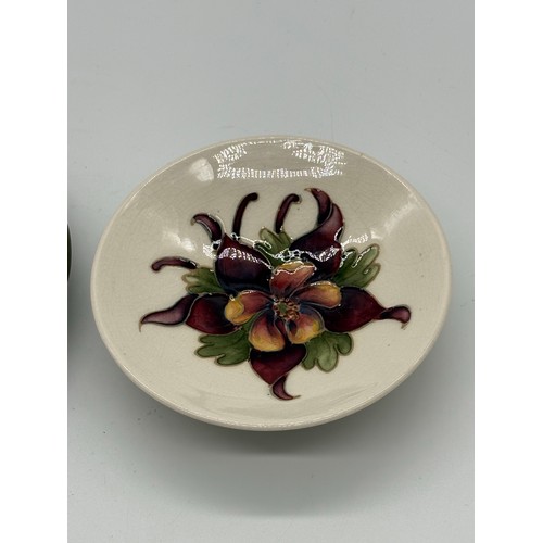 121 - 2 Moorcroft dishes to include hibiscus & columbine patterns, largest is 5