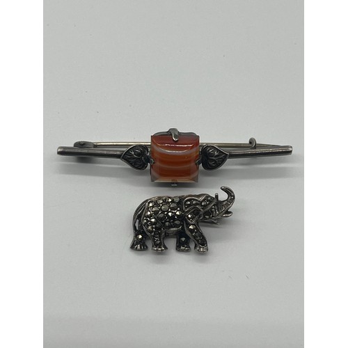 88 - Silver and carnelian brooch, silver and marcasite elephant brooch, silver plated Scottish brooch and... 