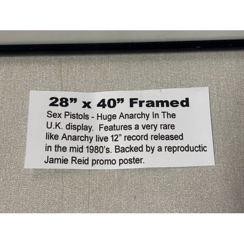 75A - Framed Sex Pistols Huge anarchy in the UK display. Features a very rare like anarchy live 12