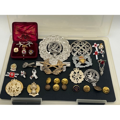 62 - Collection of military related items along with large clan and Celtic badges pins etc.