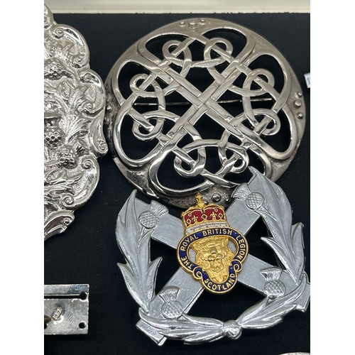 62 - Collection of military related items along with large clan and Celtic badges pins etc.