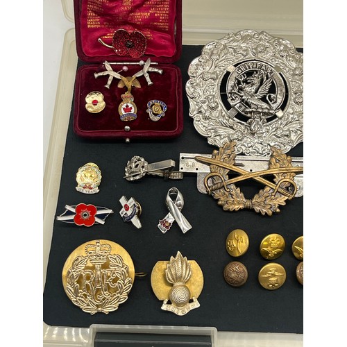 62 - Collection of military related items along with large clan and Celtic badges pins etc.