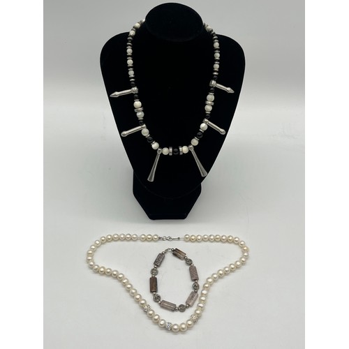 67 - Unusual tribal style necklace with onyx beads and silver toned spacers along with silver and pearl n... 