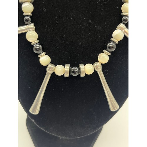67 - Unusual tribal style necklace with onyx beads and silver toned spacers along with silver and pearl n... 