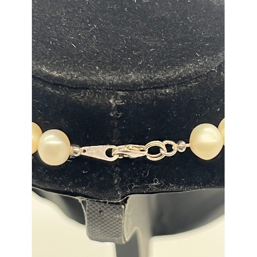 67 - Unusual tribal style necklace with onyx beads and silver toned spacers along with silver and pearl n... 