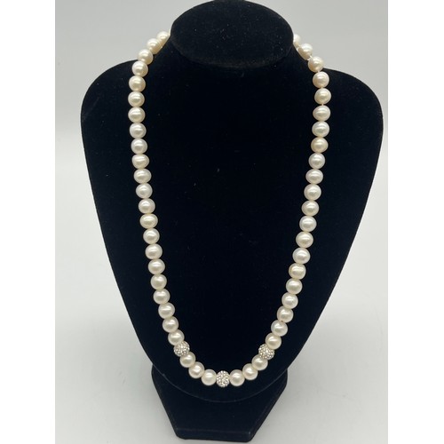 67 - Unusual tribal style necklace with onyx beads and silver toned spacers along with silver and pearl n... 