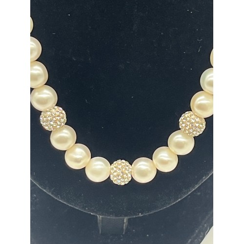 67 - Unusual tribal style necklace with onyx beads and silver toned spacers along with silver and pearl n... 