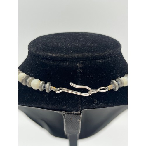 67 - Unusual tribal style necklace with onyx beads and silver toned spacers along with silver and pearl n... 