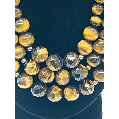 75 - Tigers eye necklace & bracelet both with silver fastenings.