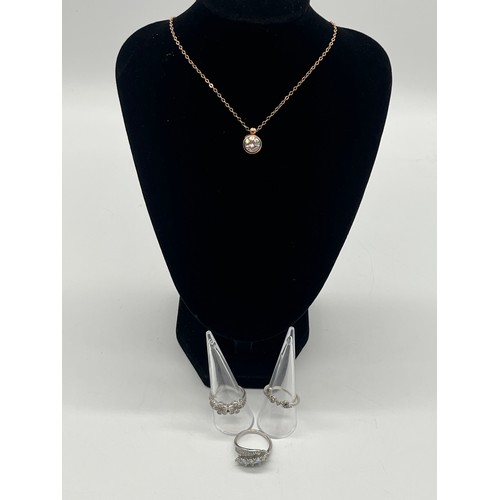 76 - Silver rose gold tone chain and pendant necklace along with silver love ring and silver daisy ring a... 