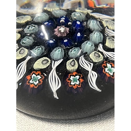 131 - Perthshire paperweight or possibly Paul Ysart featuring radial millefiori cane design with cross in ... 