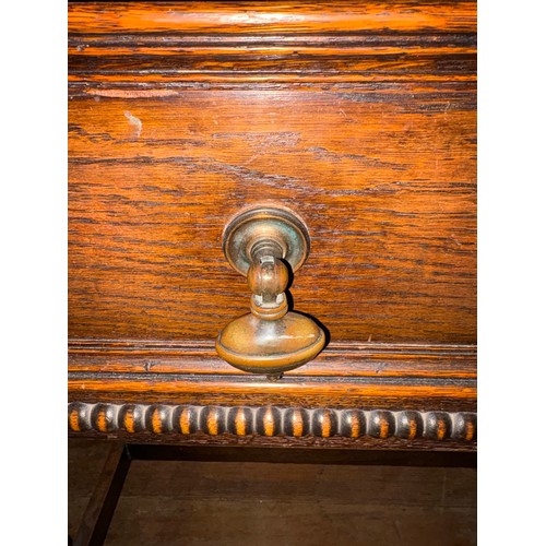 156 - Solid oak Jacobean style 2 drawer console table with heavy pull brass handles.