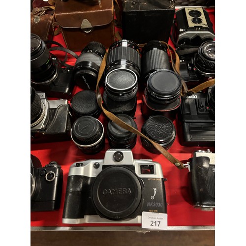 Large collection of cameras and lenses to include praktica, canon etc ...