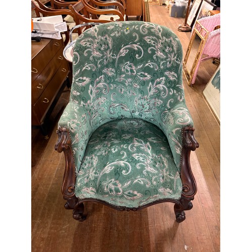 241 - A 19th century French louis XV style armchair with walnut detailing & decorative fabric upholstery