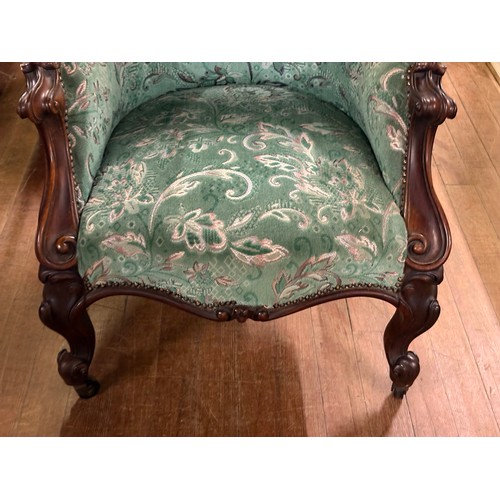 241 - A 19th century French louis XV style armchair with walnut detailing & decorative fabric upholstery