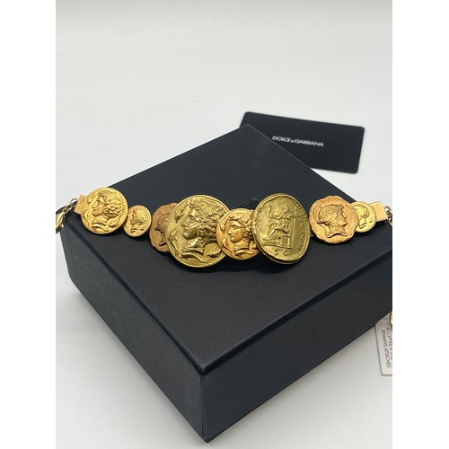 13 - Vintage Dolce & Gabbana gold tone Roman coin embellished bracelet with original box, pouch, tag and ... 