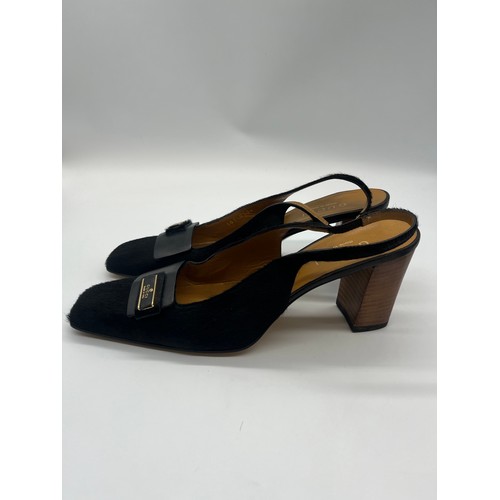 32 - Vintage Gucci pony hair slingback block heels featuring a black calfskin logo. Size 5.5