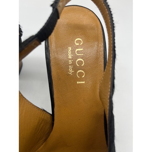 32 - Vintage Gucci pony hair slingback block heels featuring a black calfskin logo. Size 5.5