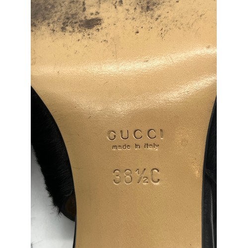 32 - Vintage Gucci pony hair slingback block heels featuring a black calfskin logo. Size 5.5