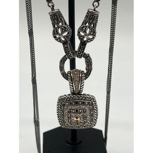 10 - Sterling silver and black diamond necklace with 14k gold accents.
