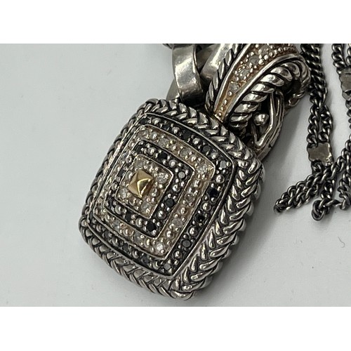 10 - Sterling silver and black diamond necklace with 14k gold accents.