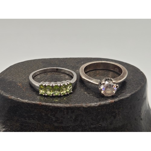 19 - 2 silver rings to include peridot.