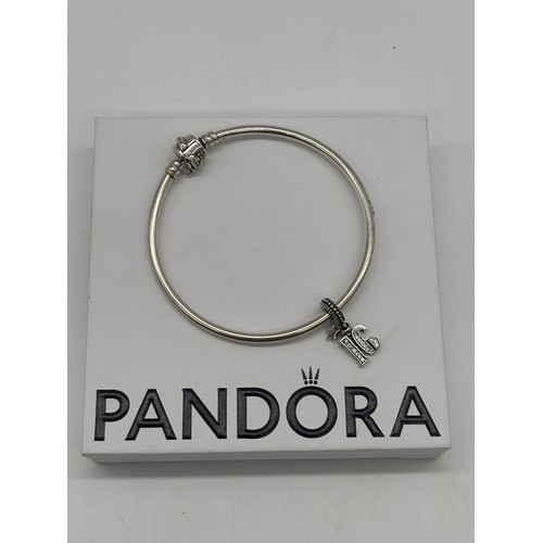 50 - A Pandora 16th charm with bracelet and box.