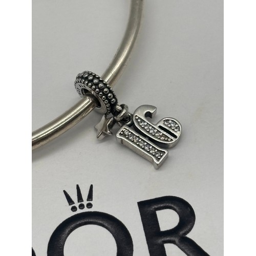 50 - A Pandora 16th charm with bracelet and box.
