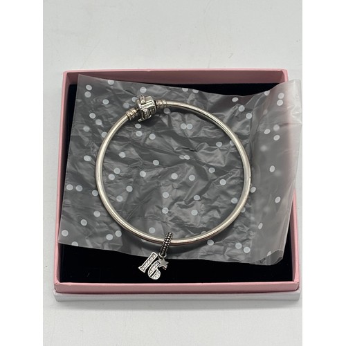 50 - A Pandora 16th charm with bracelet and box.