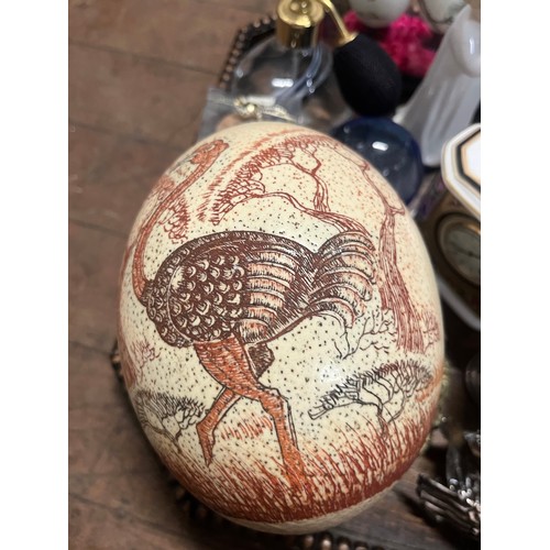 54 - Tray of collectables to include hand painted ostrich egg, plated and crystal swan cruet set and Anti... 