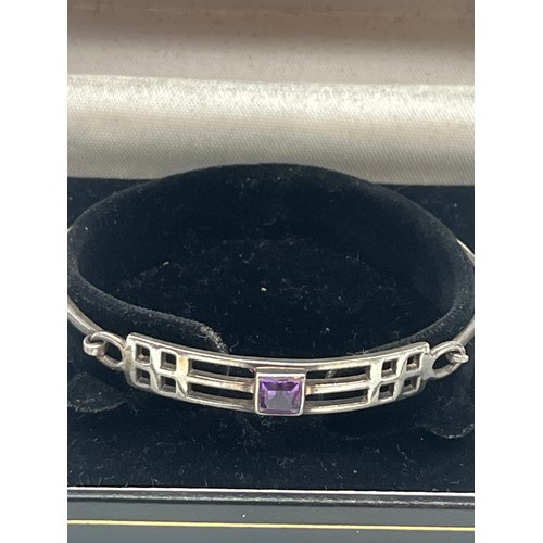 59 - sterling silver Rennie Macintosh bangle with amethyst stone