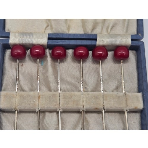 16 - Set of 6 Art Deco sterling silver cherry topped cocktail sticks in fitted case.