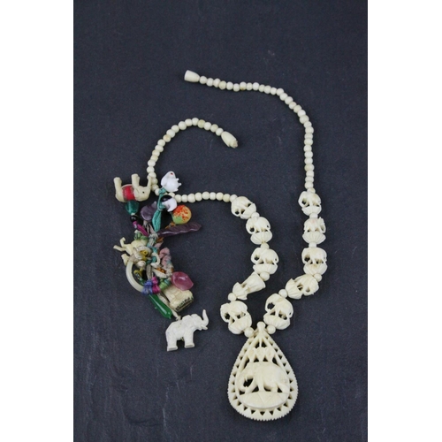 309 - Carved Bone Elephant Necklace together with Carved Bone and Stone Charms including Buddha
