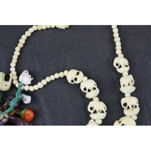309 - Carved Bone Elephant Necklace together with Carved Bone and Stone Charms including Buddha
