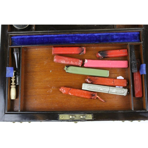 74 - Mid to Late 19th century Domed Top Walnut Writing Box with Ornate Brass Banding, the fitted interior... 