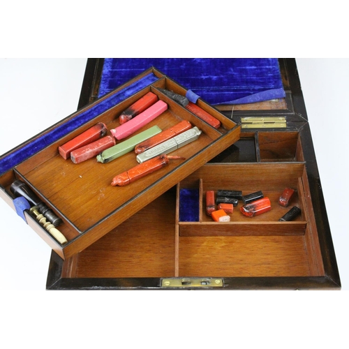 74 - Mid to Late 19th century Domed Top Walnut Writing Box with Ornate Brass Banding, the fitted interior... 