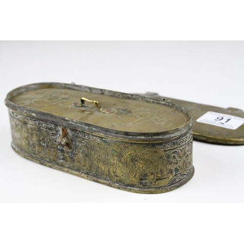 91 - Persian Brass Oval Box, the lid opening to reveal a interior panel covering a fitted interior, possi... 