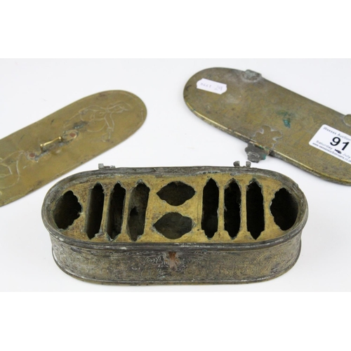 91 - Persian Brass Oval Box, the lid opening to reveal a interior panel covering a fitted interior, possi... 