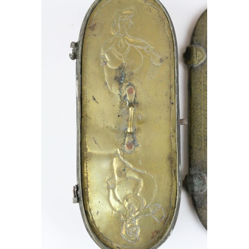 91 - Persian Brass Oval Box, the lid opening to reveal a interior panel covering a fitted interior, possi... 