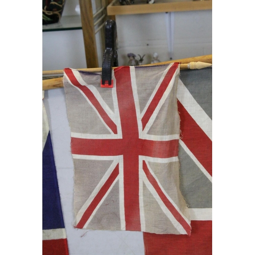 96A - Three Vintage Union Jack Flags on Poles, the largest flag 88cms x 66cms