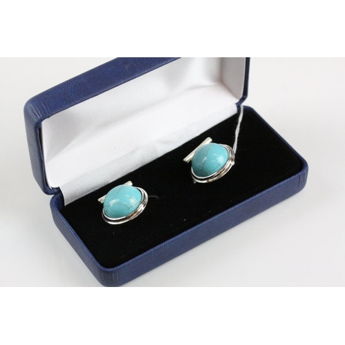 241 - A pair of silver and turquoise set cufflinks