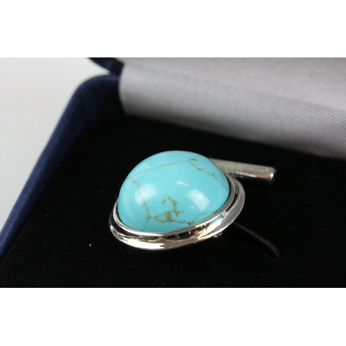 241 - A pair of silver and turquoise set cufflinks
